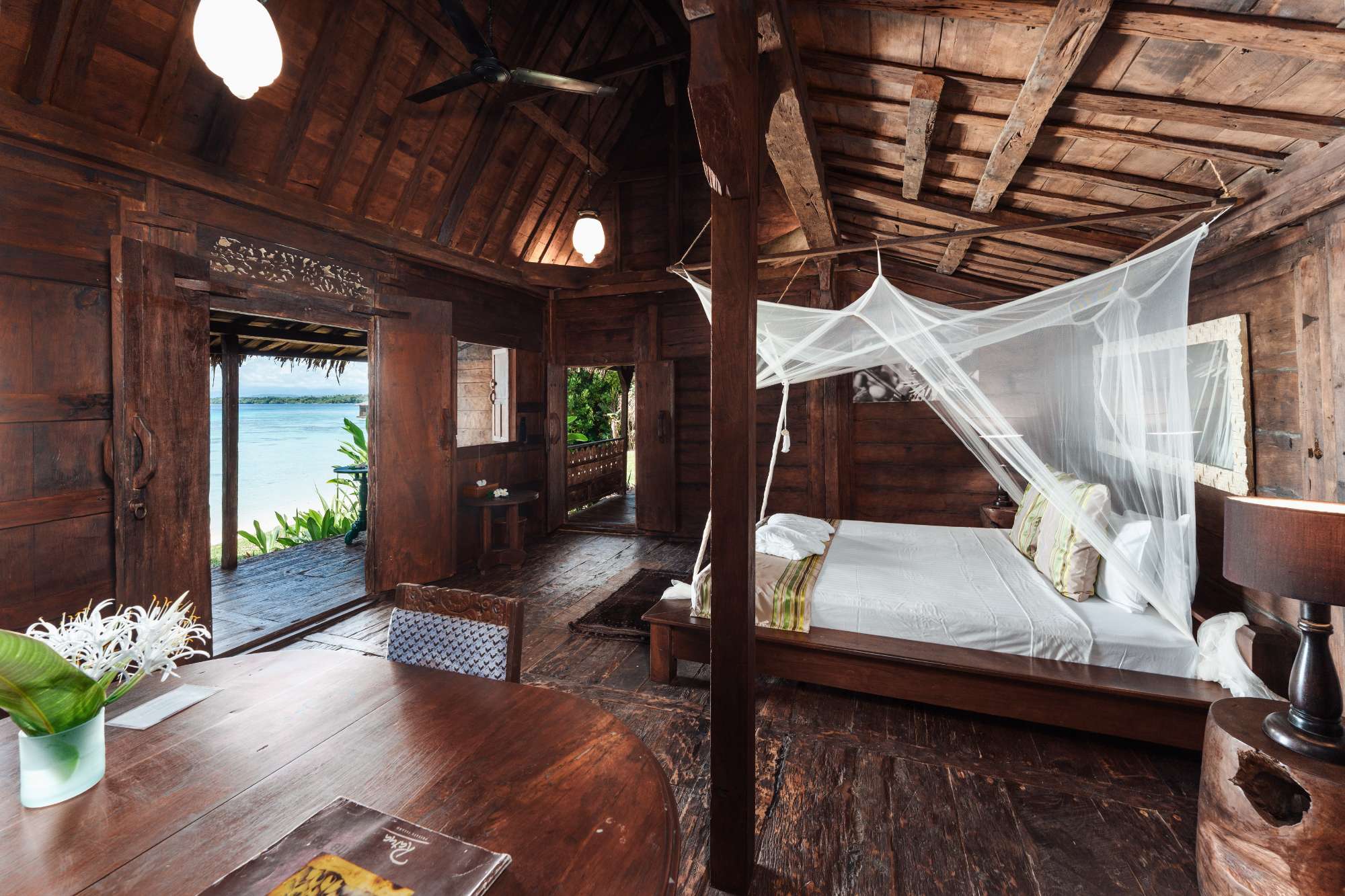 Interior of a Ratua Private Island villa with a view of the beach