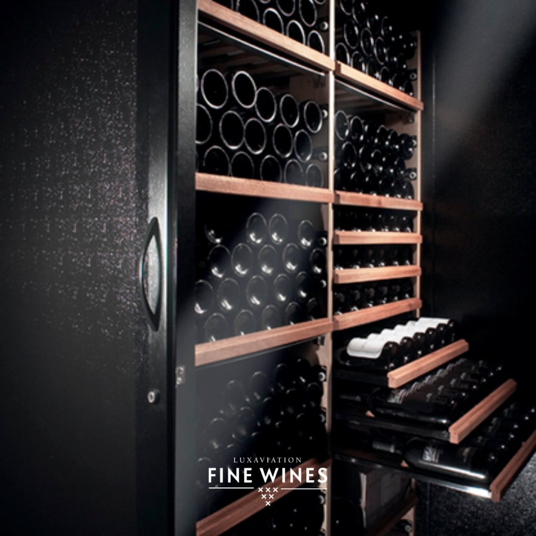 A climate-controlled wine cabinet with bottles racked on timber shelves